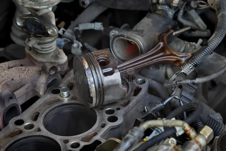 car-servicing-old-piston-engine-block-disassembly-closeup-parts-replacing-close-up-106590271