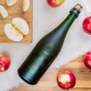 Top view of premium cider and locally grown organic apples