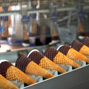 Ice cream cones on a conveyor. Ice cream factory.