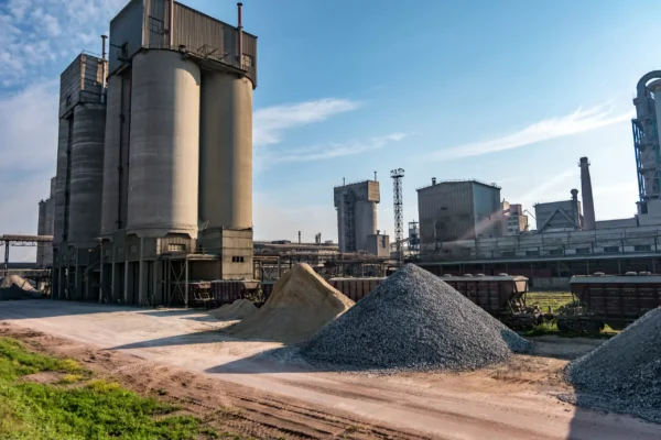 industrial-grey-landscape-environmental-pollution-waste-cement-factory-big-pipes-industry-enterprise-plant-mountains-sand-rubble-scaled